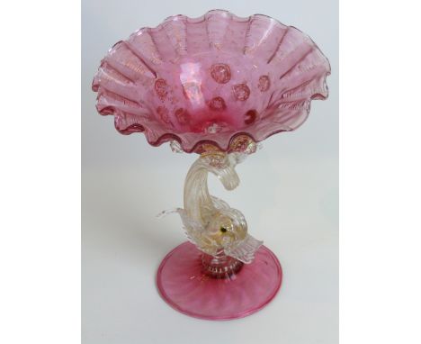 A Murano glass bowl with dolphin supportModelled in the form of a cranberry glass bowl with gilt and clear glass applied roun