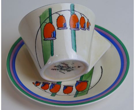 A Clarice Cliff Bizarre conical cup and saucerDecorated in the 'Solomon's Seal' pattern, circa 1930, black painted factory ma