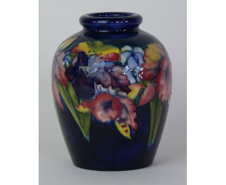 A Walter Moorcroft pottery vase of ovoid formDecorated in the Orchid pattern on a blue ground, blue signature and impressed m