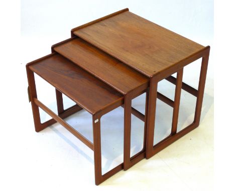 A post war Craftsmanship Danish teak nest of three graduated coffee tablesEach of typical plain form, complete with original 