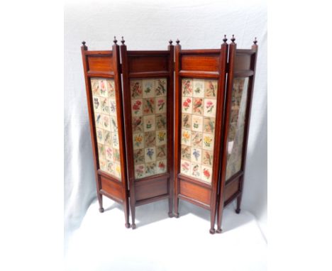AN EDWARDIAN MAHOGANY FOUR-FOLD FIRESCREEN with inlaid stringing, and framing a collection of floral cigarette silks