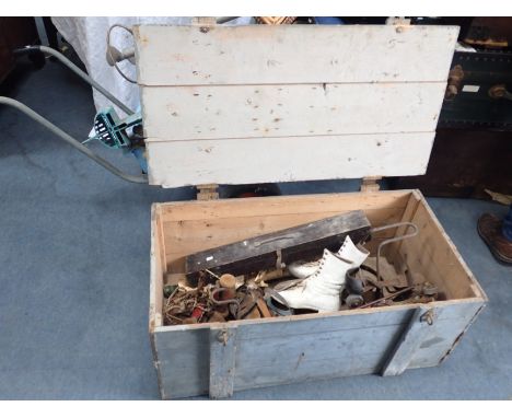 A TRUNK OF SPORTING EQUIPMENT including vintage skates, an archery set, Sandow's Developers etc (all in barn condition)