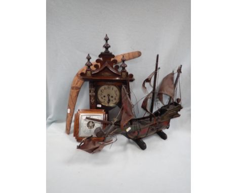 A WOODEN MODEL OF A GALLEON a Victorian clock (fitted a battery movt.), an oak-cased barometer and a boomerang