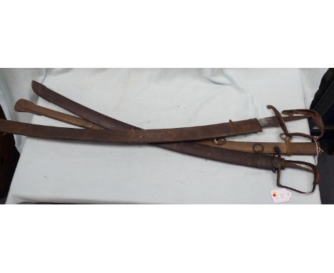 TWO NAVAL SWORDS WITH SCABBARDS one with faint engraved inscription, and another scabbard (all rusted and in poor condition)