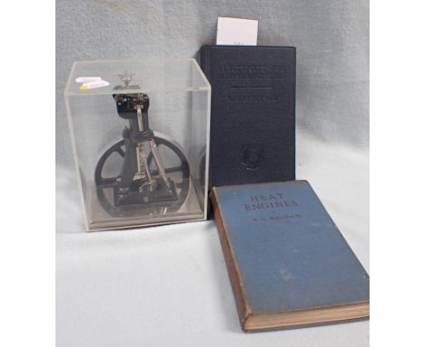 A CASED MODEL ENGINE 'Erster diesel motor der welt, gebaut 1897 von der Machinenfabrik Augsburg, Modell 1:20', and two vintag