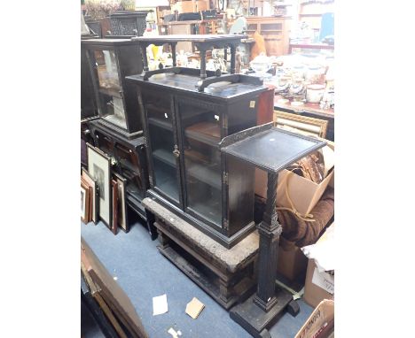 A LATE 19TH CENTURY "QUAINT" AMATEUR DESIGN EBONISED DISPLAY CABINET the partially galleried top above glazed doors, 86cm hig