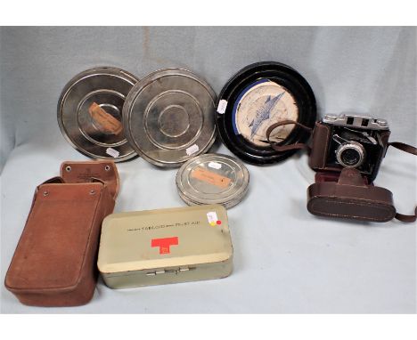 A VINTAGE 'TABLOID' FIRST-AID KIT with contents, a Ross Ensgn camera, and four film canisters