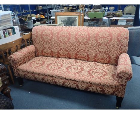 A LARGE VICTORIAN SOFA with tapering legs and heavy-duty casters 195 cm long