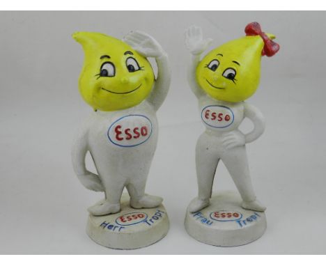 A pair of cast metal Esso advertising figures. Largest, H: 25cm