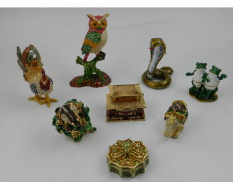 A collection of eight trinket boxes in the form of various animals. 