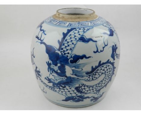 A large ovoid Chinese blue and white ginger jar, decorated with dragons chasing a flaming pearl. H: 22cm