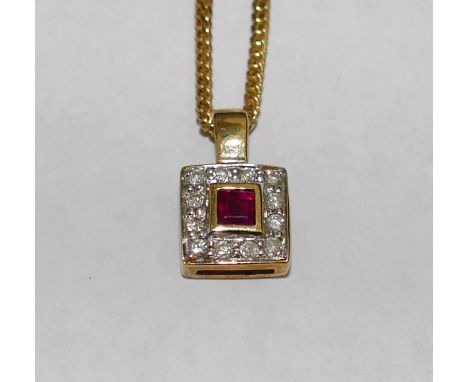 A yellow metal ruby and diamond square cluster pendant, the baguette cut ruby in yellow rub-over setting within 12 round bril