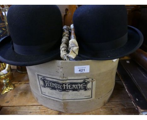 A mixed lot comprising two vintage bowler hats and a riding crop 