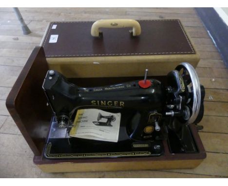 A vintage cased Singer sewing machine 