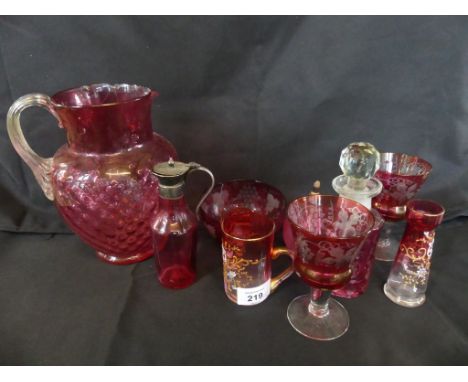 A mixed lot of various cranberry and coloured glass wares comprising small wine glasses, jug, sugar basin, small jar and othe