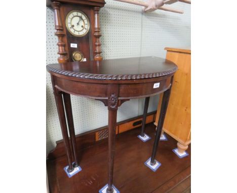 An Edwardian mahogany fold-over card table, raised on cabriole supports 