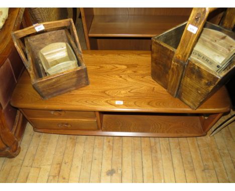 An Ercol medium elm rectangular coffee table, having two base drawers 