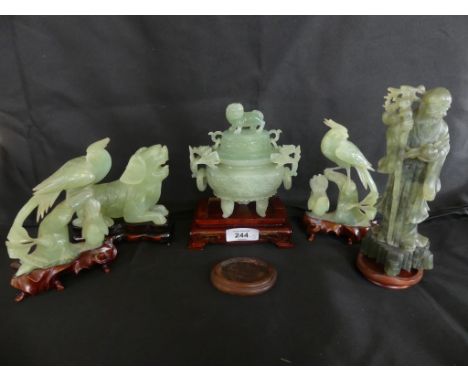 A collection of five modern Chinese jade ornaments formed as birds, a temple dog and a lidded vase together with a further mo