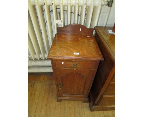An early 20th Century light oak pot cupboard, having single frieze drawer above single panelled cupboard door 