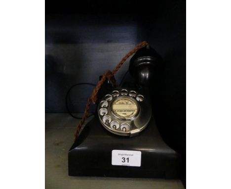 A vintage bakelite telephone 