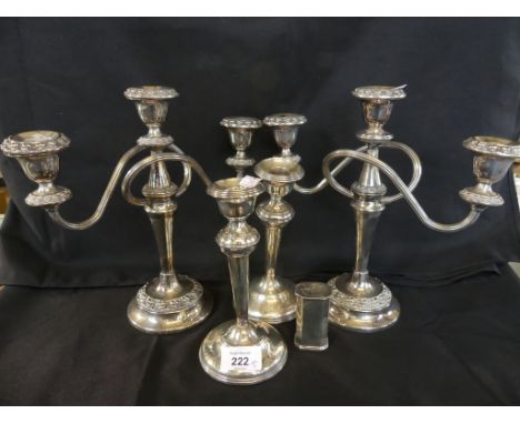 A mixed lot comprising a pair of hallmarked silver candlesticks, a pair of silver-plated three light candelabra and a further