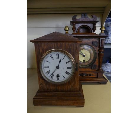 A late 19th Century walnut cased mantel clock, in architectural style case, together with a further oak cased example (2) 