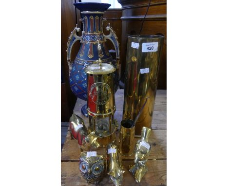A mixed lot of various brasswares including an Eccles Protector lamp, a brass shell case, various brass ornaments and a Mettl