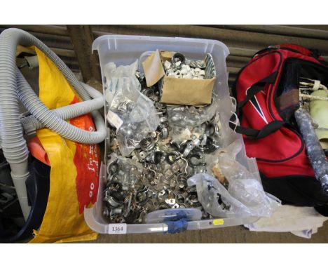 A plastic box of various pipe clamps and fittings