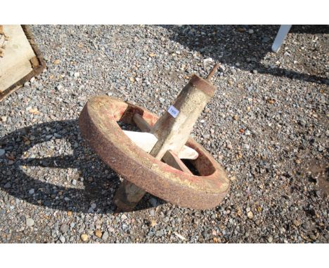 A vintage wheelbarrows wheel 