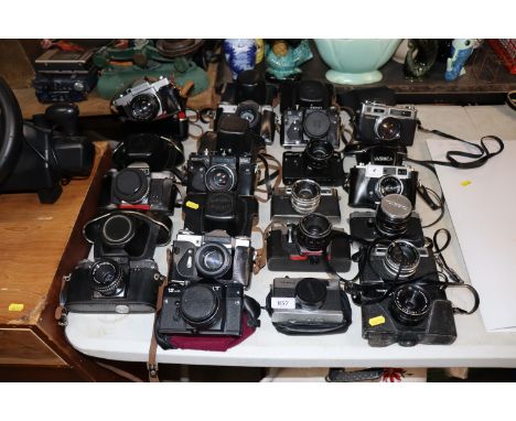 A collection of various vintage cameras including Yashica