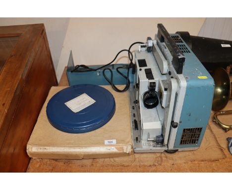 A Rank Aldis projector and 16mm film reels