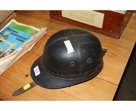 A vintage "The Corker" motorcycle helmet made by J Compton Sons & Webb limited London
