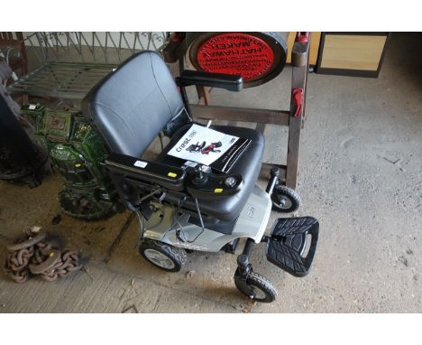 A Crest iGo electric self propelled wheelchair with charger, user manual, vendor reports purchased in June 2023