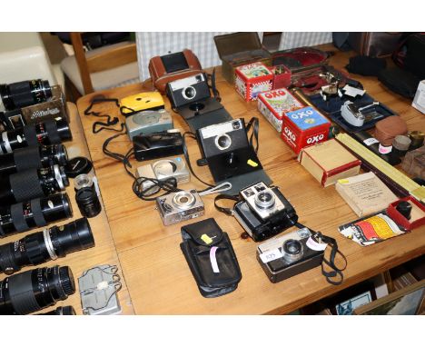 A collection of vintage and modern cameras