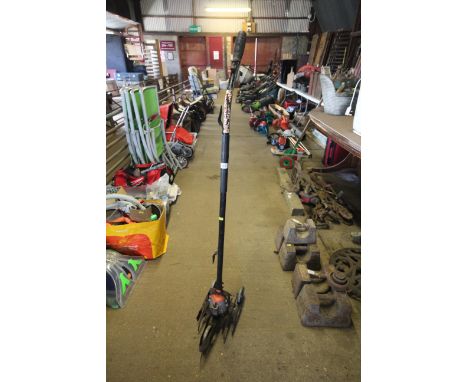 An early electric grass trimmer, sold as collectors item