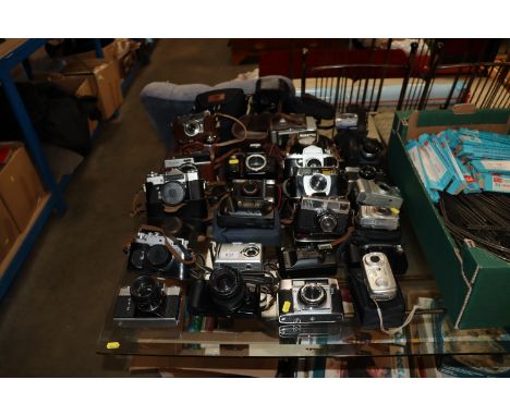 A collection of various vintage and modern cameras 