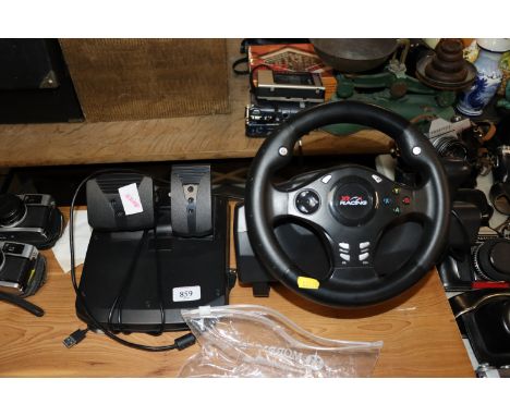An XR computer console steering wheel and pedals 