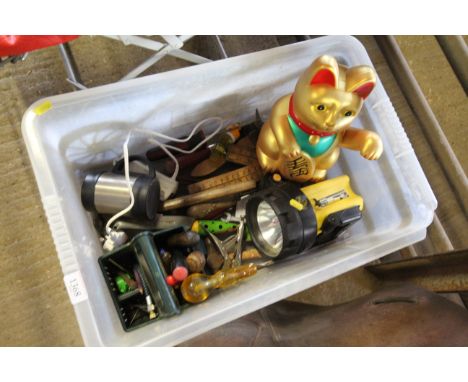 A box of various miscellaneous items to include torch, hand tools, travel mug, wooden rules etc.