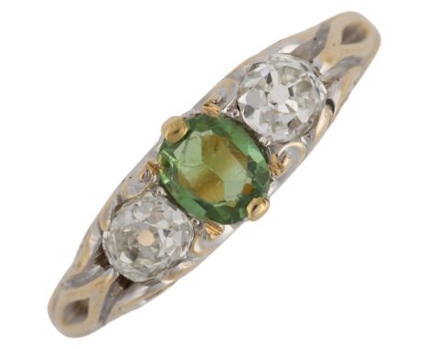 A 19th century three stone demantoid garnet and diamond half hoop ring, unmarked gold settings with oval mixed cut green garn