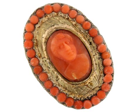 An Antique coral cameo ring, unmarked yellow metal settings with relief carved panel depicting figural portrait, setting heig