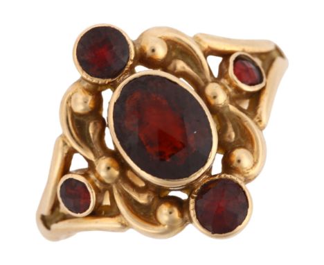 A 14ct gold garnet dress ring, set with rose-cut garnets and foliate decoration, maker's marks CN, setting height 15.8mm, siz