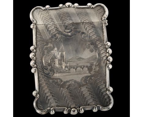 An Antique unmarked silver card case, allover engine turned decoration with engraved village and lake scene, circa 1900, 9cm 