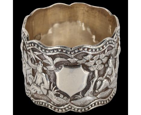 A Chinese export cast-silver napkin ring, relief village scene decoration, by Wang Hing, circa 1900, diameter 4.5cm, 1.6ozNo 