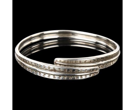 DAVID ANDERSEN - a Norwegian sterling silver leaf bangle, band width 10.8mm, internal circumference 21cm, 35.7gNo damage or r