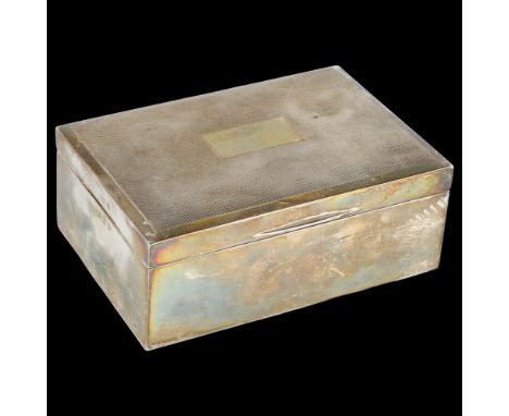 An Elizabeth II silver cigarette box, with engine turned lid, by Harman Brothers, hallmarks Birmingham 1975, 13cm x 9cm, 13.8