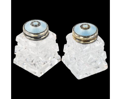 A pair of Norwegian sterling silver-gilt, blue enamel and glass pepper pots, height 4cmGlass has a few tiny edge nibbles othe