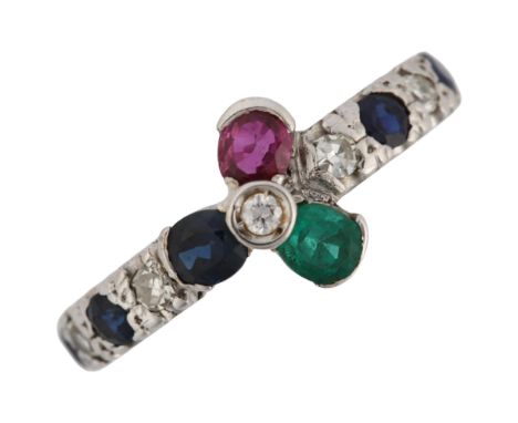 An 18ct white gold gem set flowerhead ring, gemstones include ruby sapphire emerald and diamond, setting height 9.3mm, size K