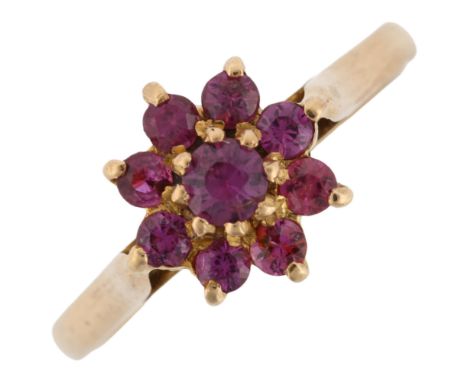 A 9ct gold ruby cluster flowerhead ring, setting height 10.3mm, size Q, 2.6gNo damage or repairs, all stones present, mark cl