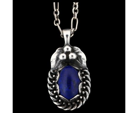 GEORG JENSEN - a Danish stylised sterling silver and lapis lazuli pendant necklace of the year 1992, on silver fancy link cha