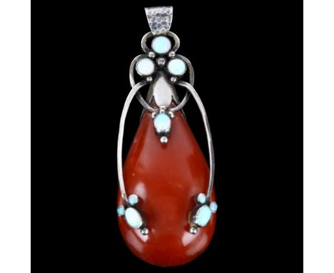 FIR HASSING - a large Danish secessionist silver Baltic amber and opal pendant, of stylised openwork form with planished bale